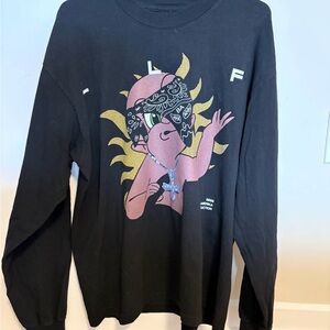 Black Graphic Long Sleeve Tee with Pink Character and Gold Accents
